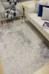 Мек килим Галакси със синя асиметрична фигура
